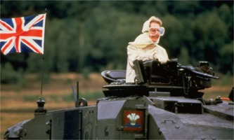 Margaret Thatcher posing on tank